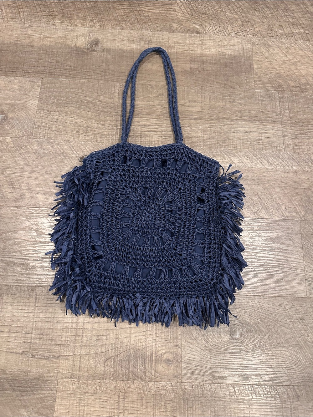Navy shoulder bag is a Most Wanted USA Seagrass Woven bohemian-inspired design.